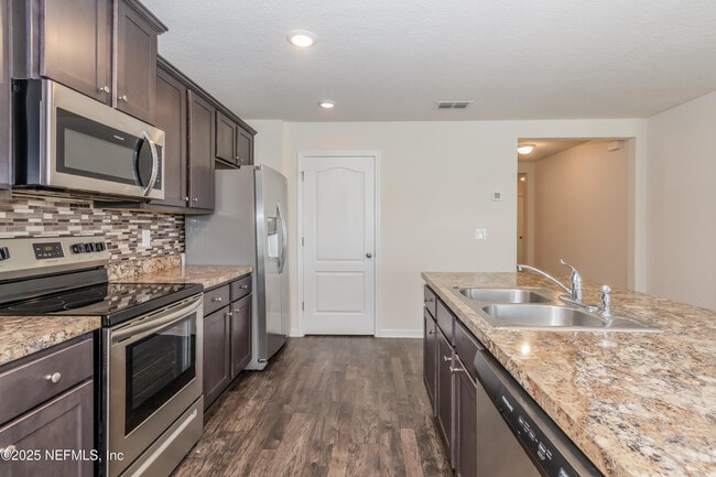 Building Photo - 15697 Saddled Charger Dr