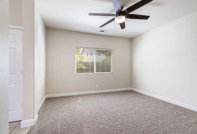 Building Photo - Four bedroom/2-bath home with 2-car garage