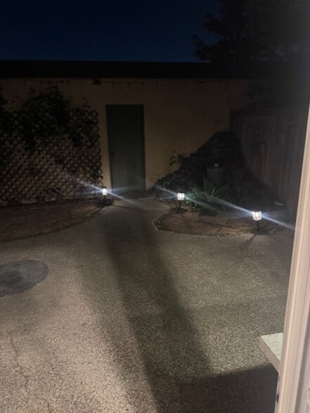 private back patio leading to garage - 15955 Mauna Ct