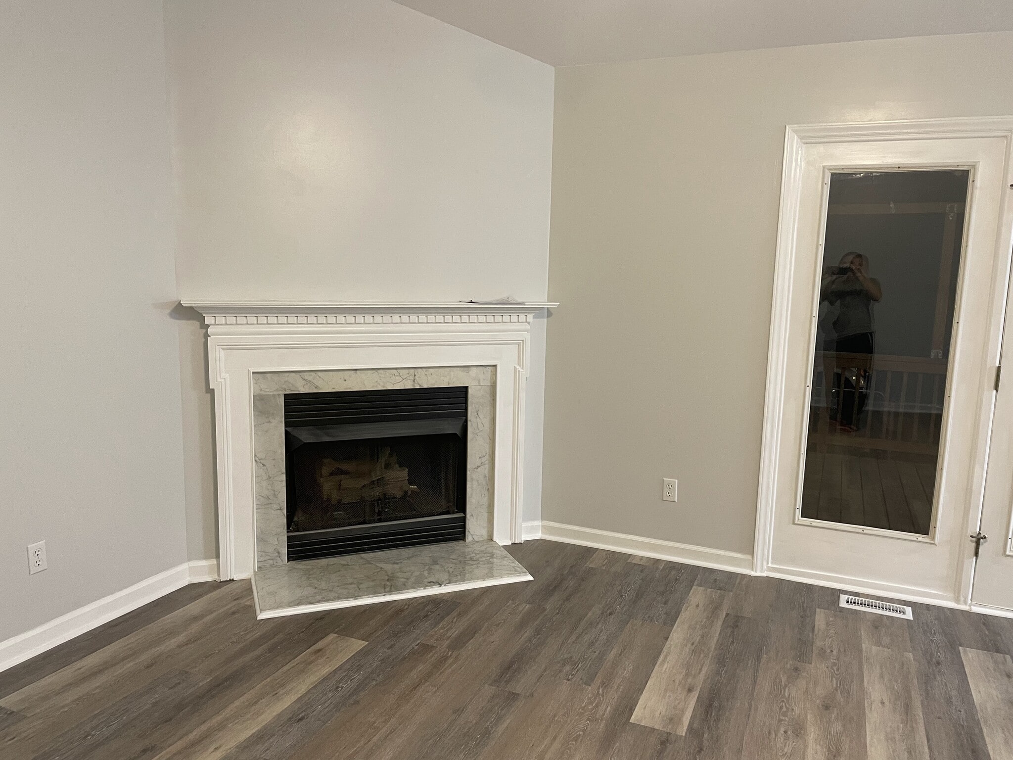Fireplace and Back Door in Living Room - 104 Ironwood Ln