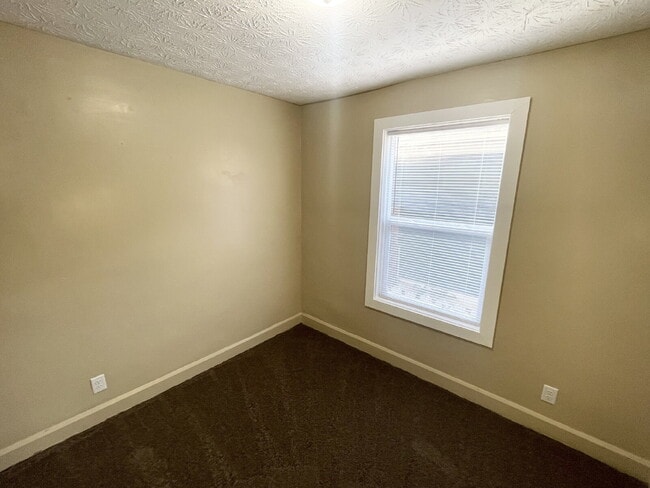 Building Photo - 3 Bedroom Home  with huge, 2-car garage/workshop combo (has electricity)