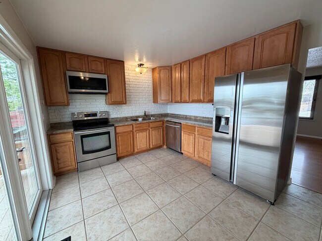 Building Photo - 4-Bed Home Near Clement Park with Entertainer’s Basement & Outdoor Oasis