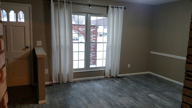 Living room with new tile - 425 Spruceway Dr