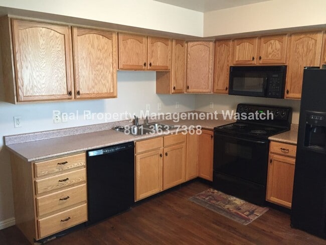 Building Photo - Pet Friendly 2 Bed 1.5 Bath Condo in Midvale