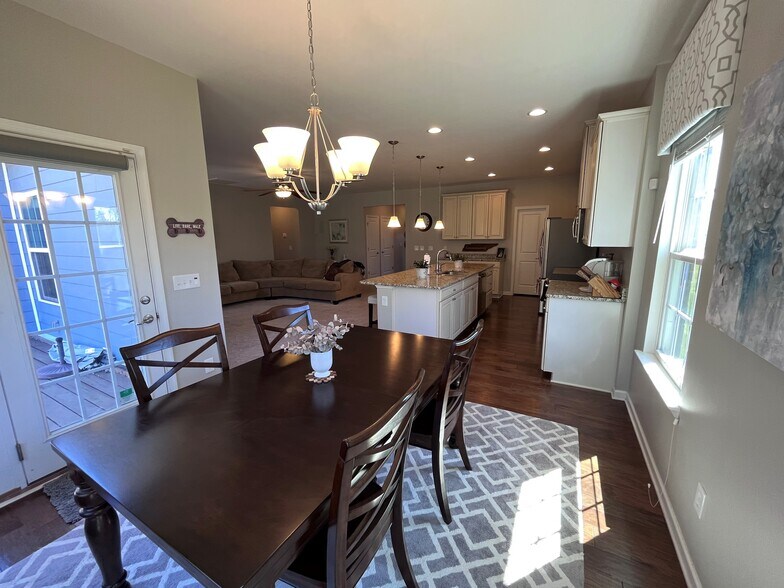 Looking back into the great room and kitchen, with loads of storage and huge pantry! - 7736 Tranquil Trl