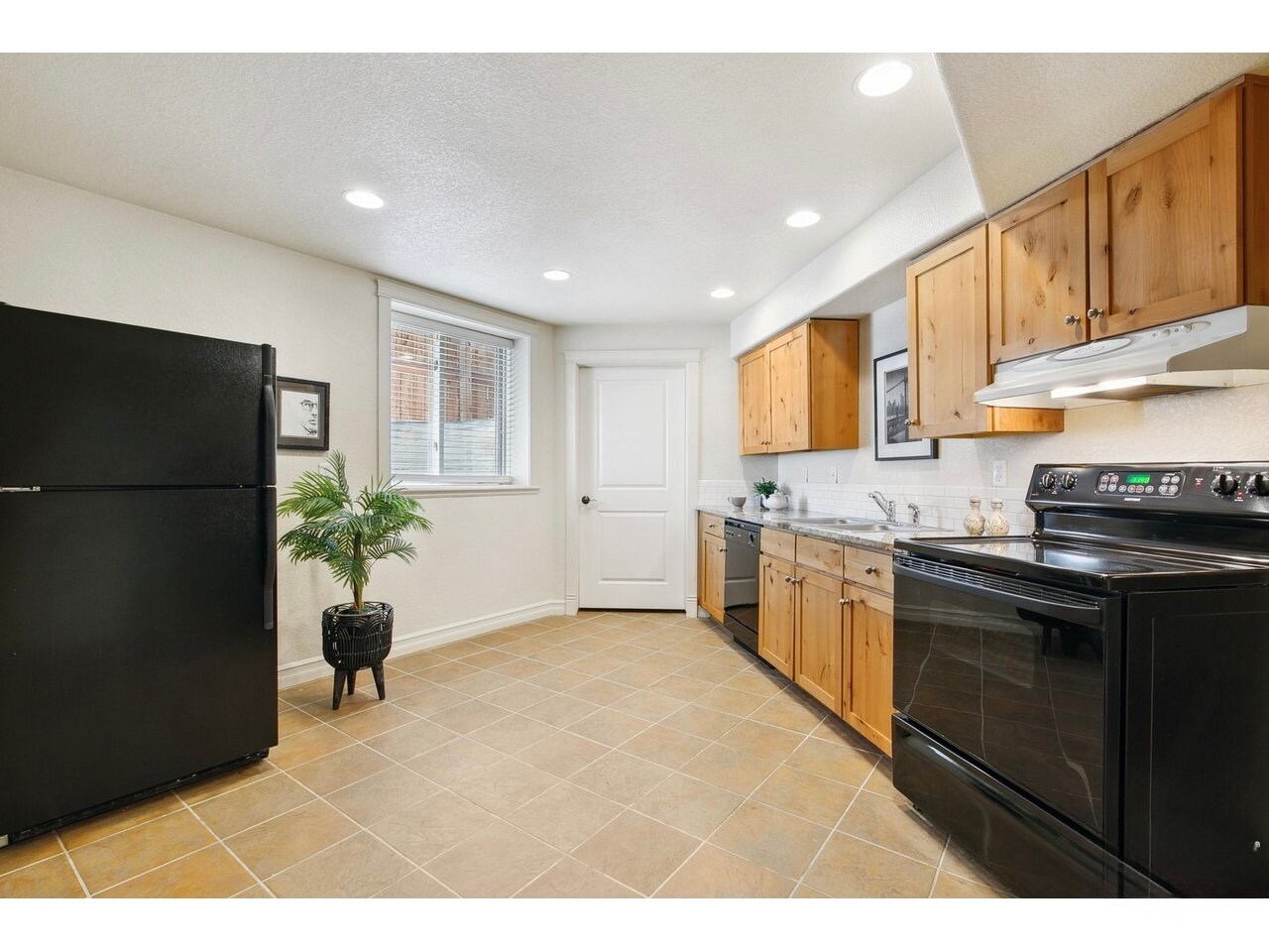 kitchen and door to laundry & unfinished storage - 1005 Laporte Ave