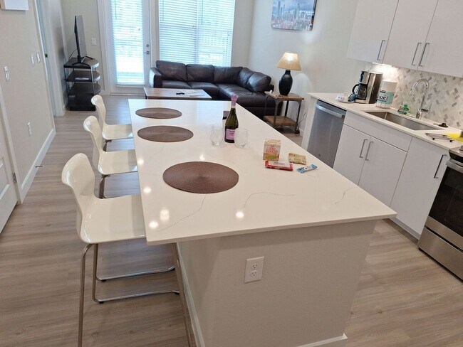 Building Photo - Your urban prairie sanctuary is here! One of a kind apartment homes where art, luxury & convenien...