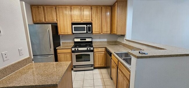 Building Photo - TANAMERA CONDOMINIUMS 1 bed 1 bath 1 car g...