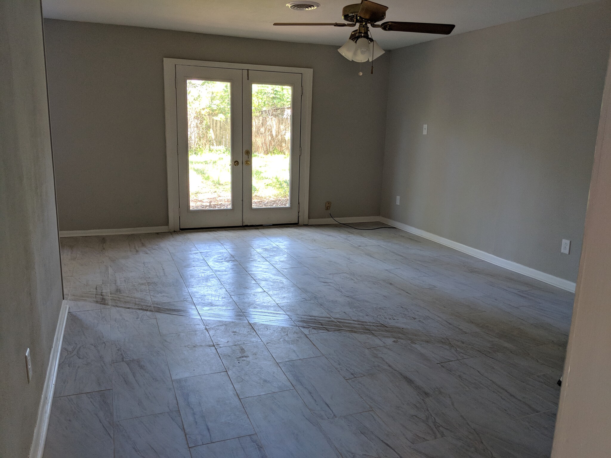 Livingroom with double doors leading to back yard - 5478 Birdwood Rd