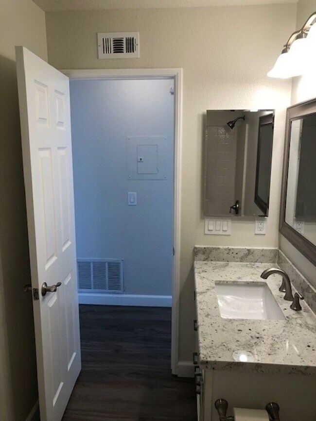 Building Photo - PICTURE PERFECT 2 BR/2 BATH PLUS LOFT END UNIT CONDO WITH DIRECT ACCESS 2 CAR GARAGE