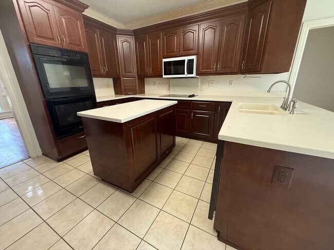Building Photo - Spacious 5-Bedroom Home on a Corner Lot in...