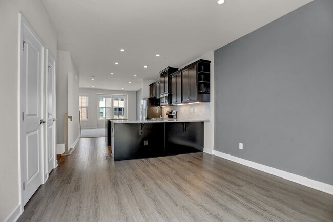 Building Photo - Luxury 4-Story Townhome with Rooftop Terrace!