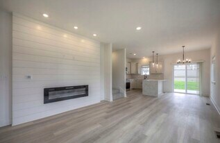 Bright Open Living Space with Electric Fireplace & Natural Light - 22907 W 72nd Ter