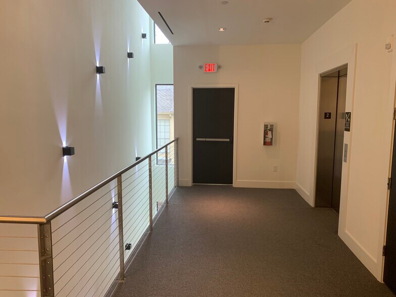 Common area Light Wall with elevator to parking garage - 3923 Cole Ave