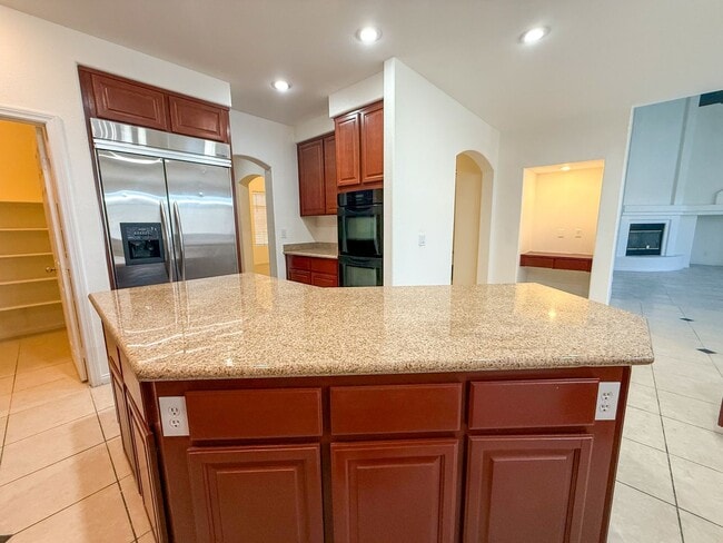 Building Photo - SPACIOUS HOME IN GATED COMMUNITY WITH POOL, RV PARKING & 4-CAR GARAGE!