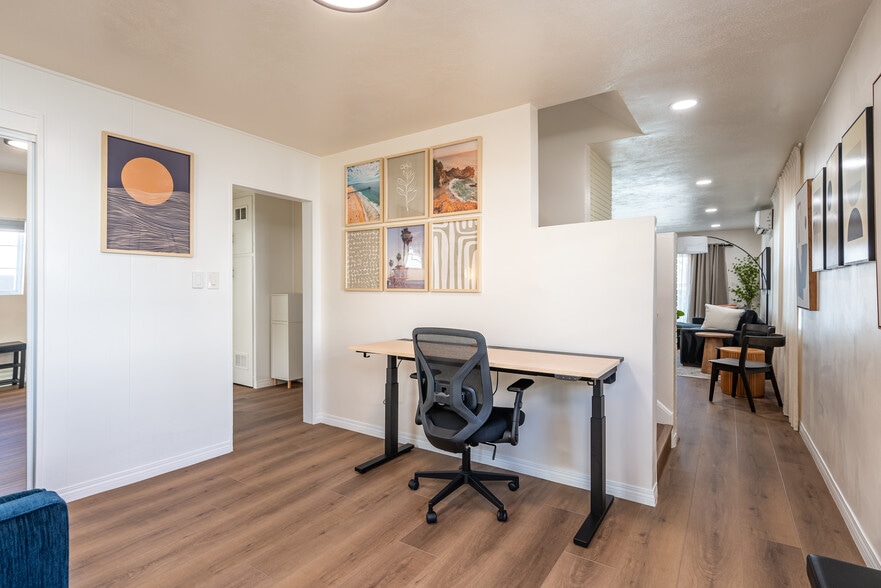Den/Office, downstairs View from backdoor toward wide workspace, hallway, stairway, and living room. - 4746 W 159th St