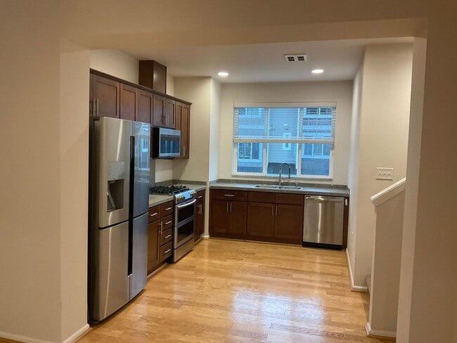 Building Photo - Riverfront Townhome with Tandem Garage & Fenced Yard