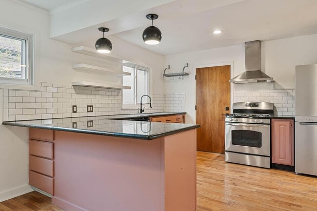 Building Photo - Beautiful, modern 4-bdrm/2-bath home in Concordia—Private, urban sanctuary w/ flex spaces