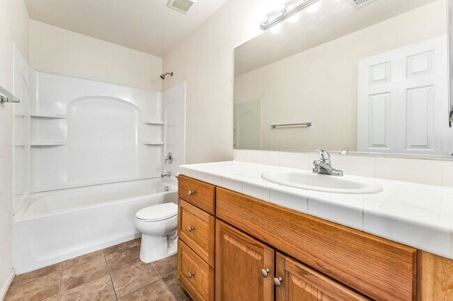 Building Photo - Stylish Two-Story Home with Loft and Dual Balconies in a Bright, Open Layout!