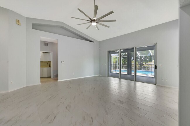 Building Photo - A BOATER'S PARADISE WITH THIS STUNNING 3 BEDROOM, 2 BATH WATERFRONT POOL HOME W/DOCK & BOAT LIFT ...