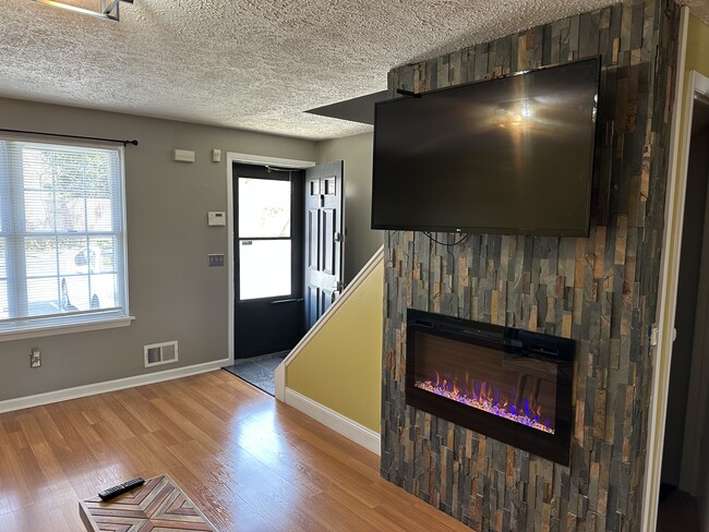 Electric Fireplace surrounded with slate stone - 1082H Mount Hope Ave