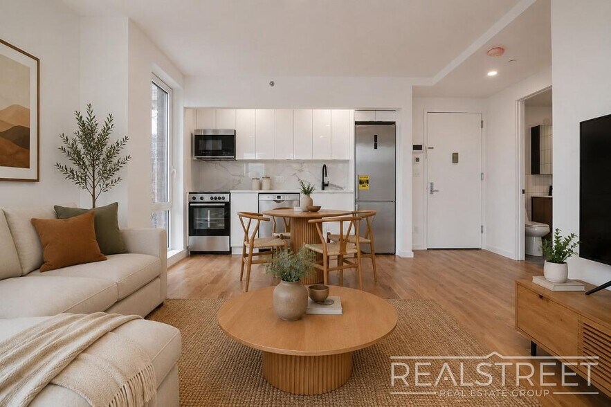 Building Photo - Light-Filled Corner 1BR with Private Outdoor Space & In-Unit Washer/Dryer