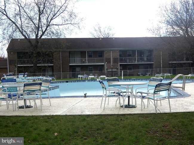 Pool Area with Tables, Chairs and Loungers - 1 Wexford Dr