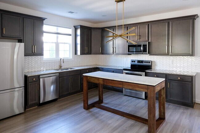 Building Photo - Like-new 3 bedroom, 2.5 bath house with an organic pond!