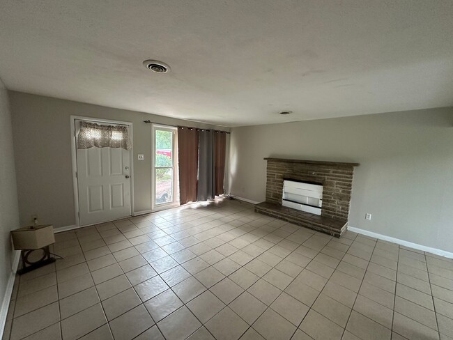 Building Photo - ONE LEVEL BRICK RANCHER WITH EXTRA LARGE LOT