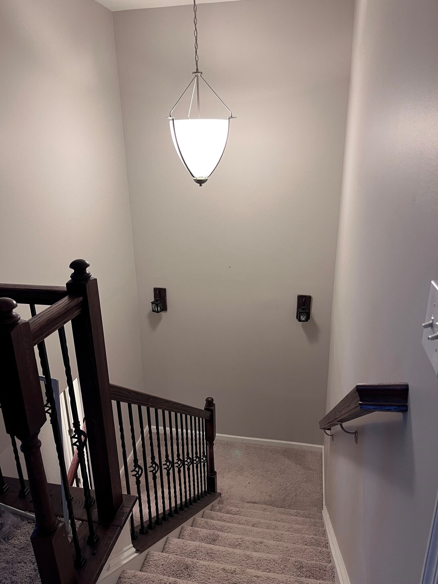 Beautiful wrought iron staircase banister leading you to the upstairs to the second living area - 7736 Tranquil Trl