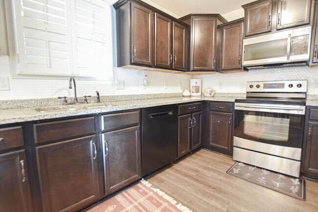 Building Photo - Pet Friendly Three Bedroom with Bonus!