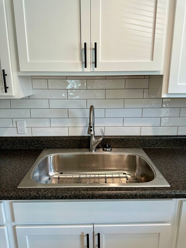 Large oversized SS sink with grate - 2304 Belle Ave NE