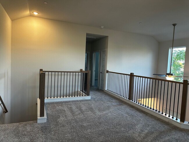 Building Photo - For Lease – Modern 2023 Condo Backing to Greenbelt | Creekside at Pioneer Crossing West