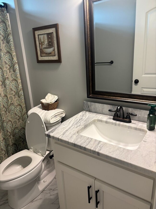 Building Photo - Spacious 4BR/3BA Creekside West Home with Screened Porch, Fenced Yard & 3-Car Garage