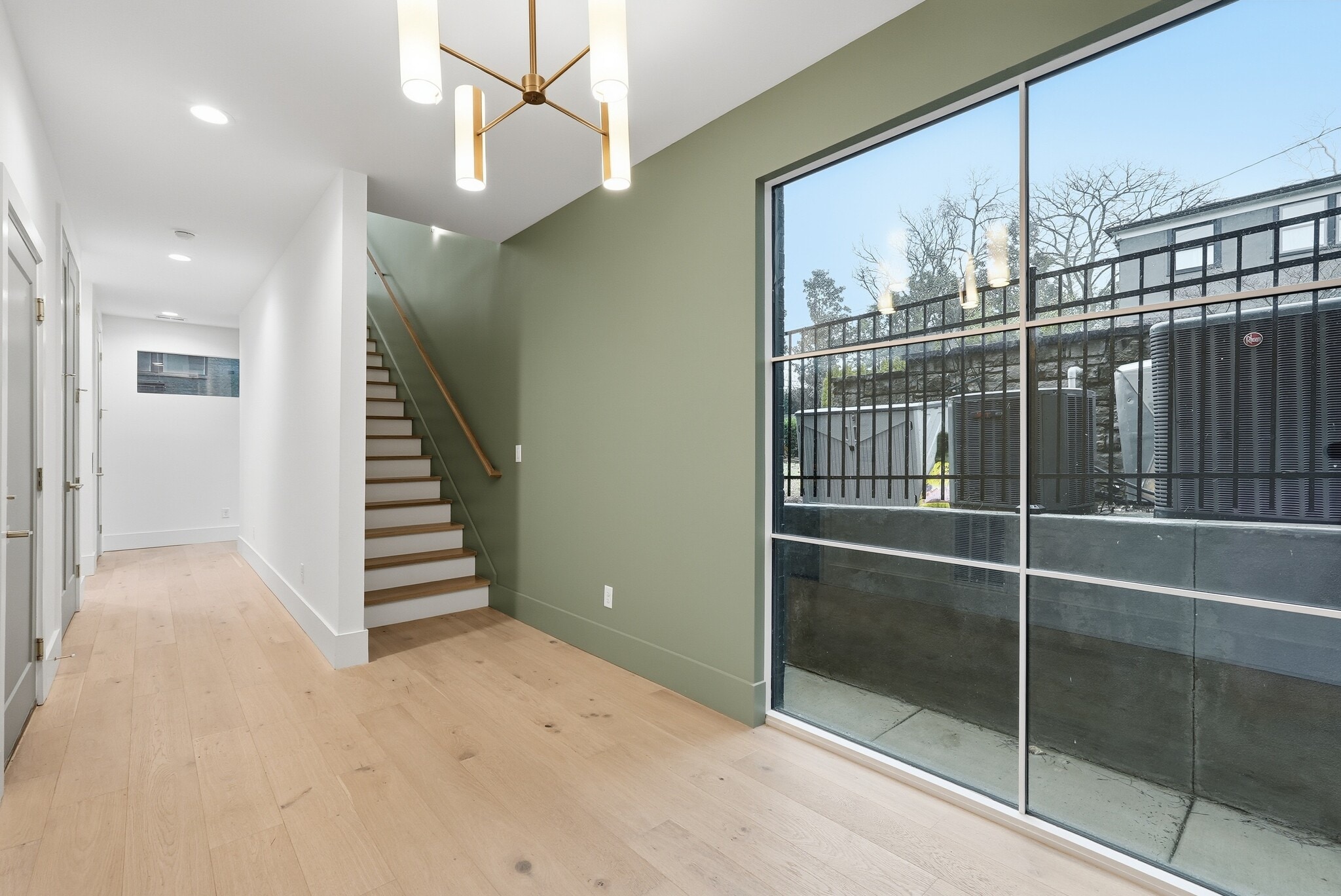 Welcoming entry way with staircase and oversized windows - 3718 West End Ave