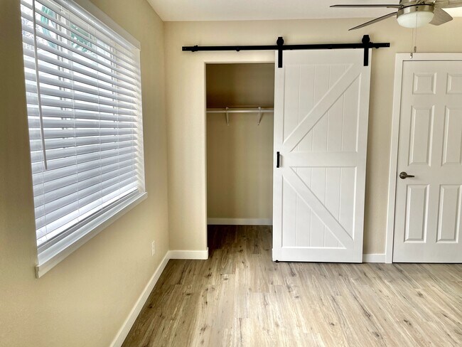 Beautiful barn door and walk in closet - 12838 Arezzo Cir