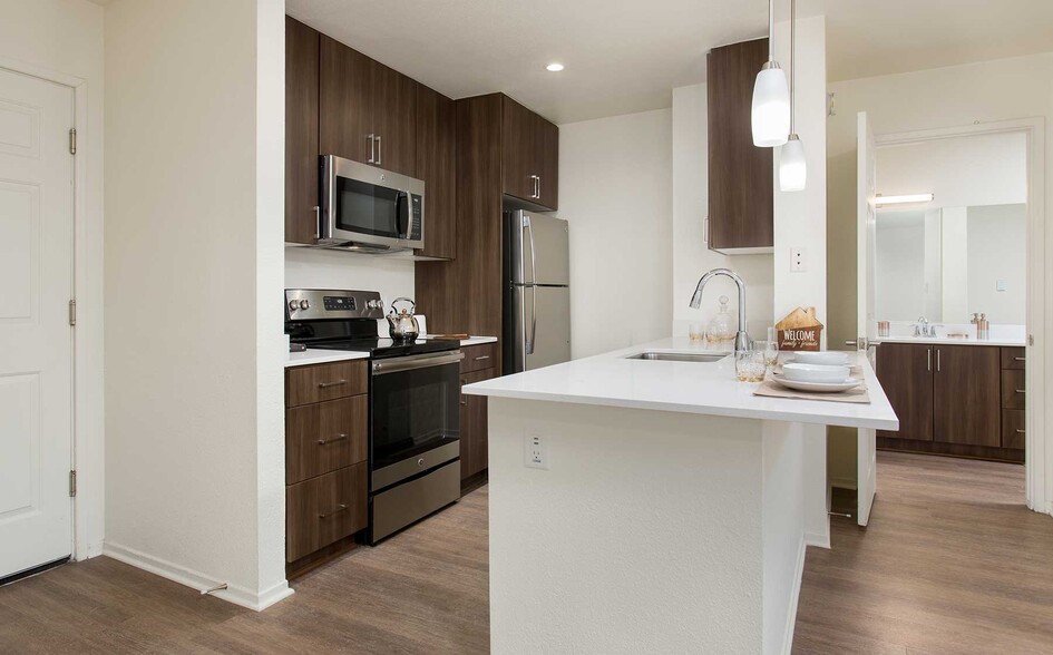 Premium Apartment Kitchen with Stainless Steel Appliances - eaves Seal Beach