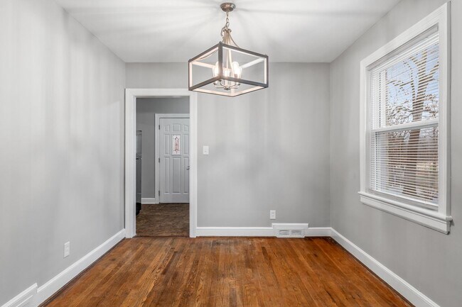 Building Photo - Brick home, Two Story, Hardwoods, DR, 2 Sun Rooms, FP, Carport!.