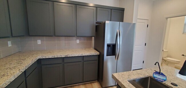 Building Photo - Beautifully designed modern townhome with attached garage.