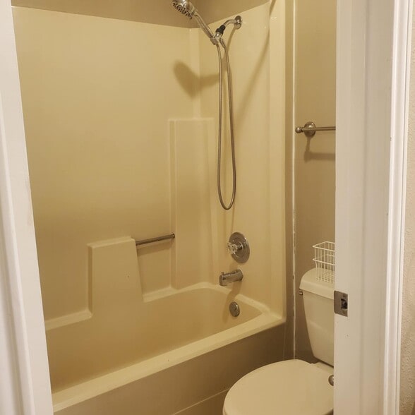 Private, ensuite bath with tub/shower, toilet in one room and vanity area open to bedroom - 12114 Lemon Blossom