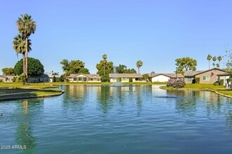 Building Photo - Welcome to this stunning updated 2-bedroom, 2-bathroom home on a lake located in the vibrant comm...