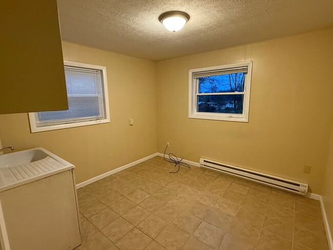 Building Photo - Updated 4BR Home with Finished Basement & Level Yard