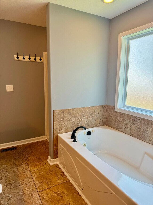 Building Photo - Large Open 4 Bedroom Home with Bonus! Tree Lined Backyard with Privacy Fence!