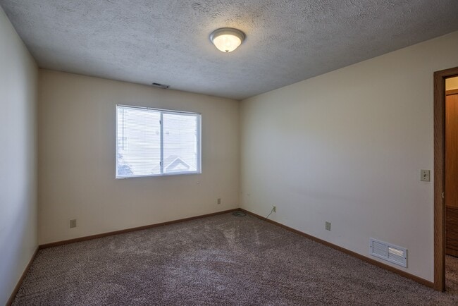 Large bedroom with carpet at Gretna Oaks. - Gretna Oaks