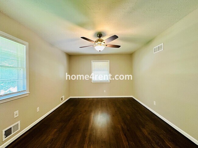 Building Photo - Like New, Ranch Style Home in Raytown - Wood Floors, Finished Basement, Fenced Yard!