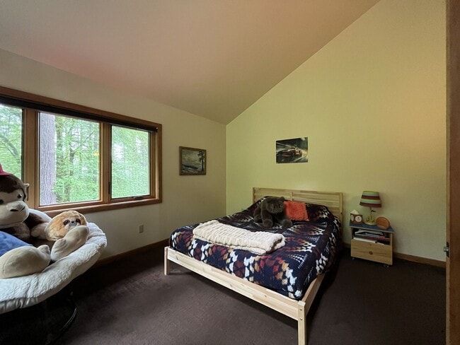 Building Photo - One-of-a-Kind Custom Home with Wall of Windows, Stone Fireplaces, Expansive Entertainment Space &...