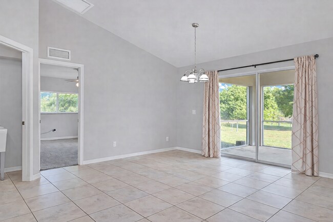 Building Photo - Spacious Three-Bedroom Home with Open Floor Plan, Large Yard & Screened Patio