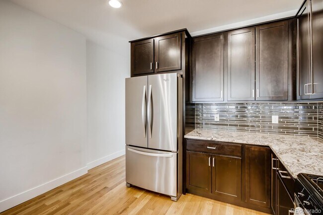 Building Photo - "Charming 2-Bed, 2-Bath Home with Gleaming Hardwood Floors in Vibrant Denver!"