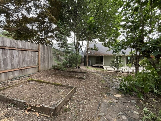 Building Photo - Spacious 3-Bedroom Home with Custom Stone Fireplace, Attached 2-Car Garage & Expansive Backyard i...