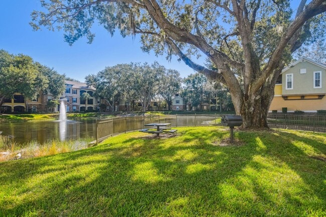 Building Photo - Elegant 1-Bedroom Condo with Lakeside Views in Resort-Style Community